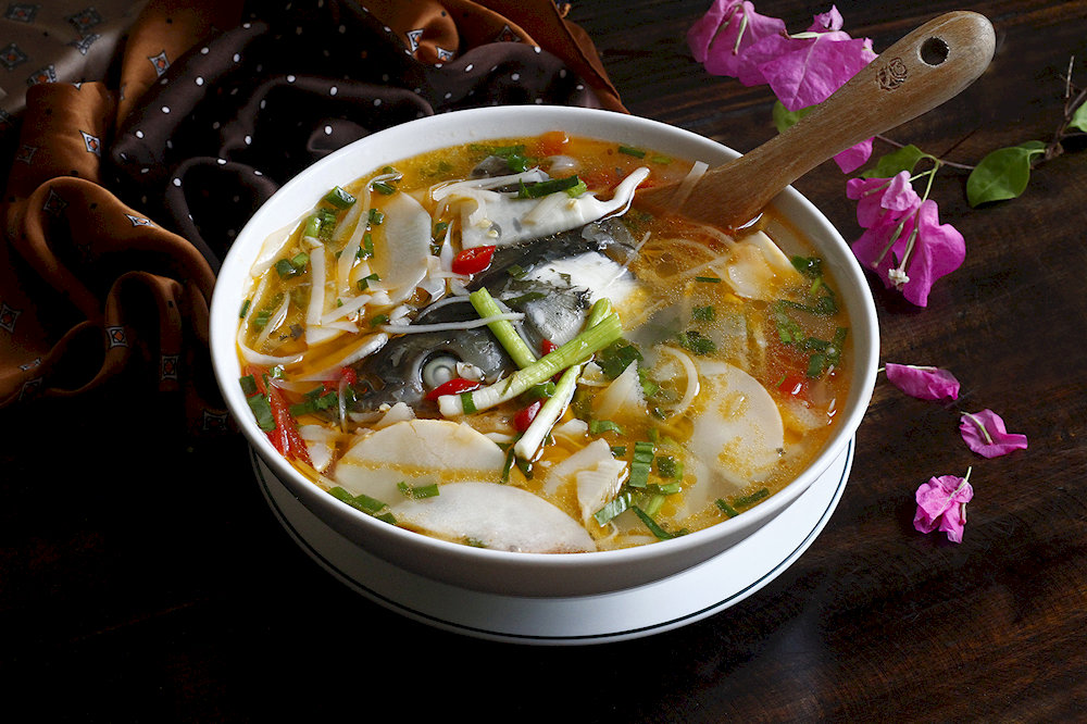 A traditional mountain delicacy featuring tender bamboo shoots paired with fresh stream fish